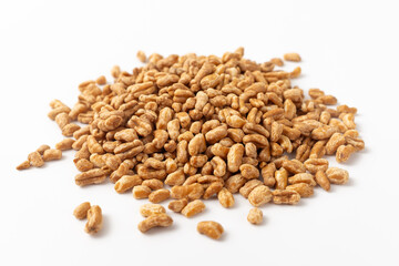 Roasted kamut on white background