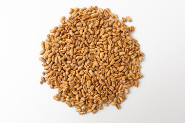 Roasted kamut on white background