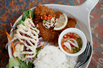 Deep Fried Dolly Fish Steak with rice. Soft focus.