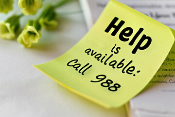 "Help is Available: Call 988" Note on Yellow Sticky Note
