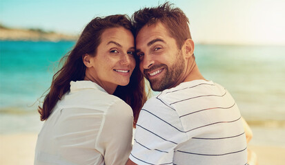 Love, portrait and smile with couple on beach together for anniversary, date or romance in summer....