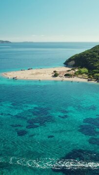Aerial view o a beautiful wild beach on Marathonisi Island near Zakynthos island in Greece. Marathon island at sunrise in Zante, Ionian sea. Paradise island with turquoise sea water.