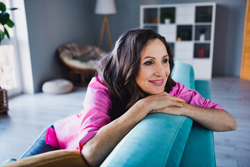 Photo portrait of attractive retired woman sit lean on sofa weekend dressed stylish pink clothes...