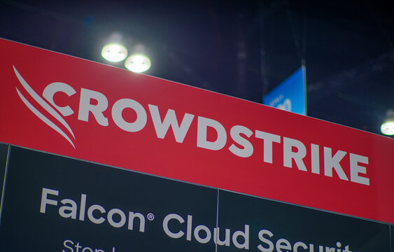 LOS ANGELES, CA- May 22, 2024: Crowdstrike logo on Crowdstrike's booth at AWS Summit in Los Angeles Convention Center.