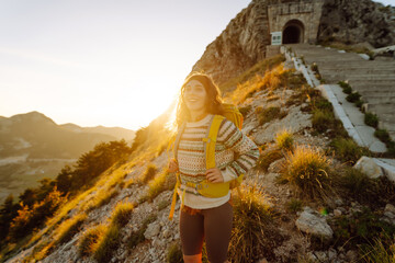 Young woman in  Popular tourist attraction of Negosh Mausoleum on the top of the high and...