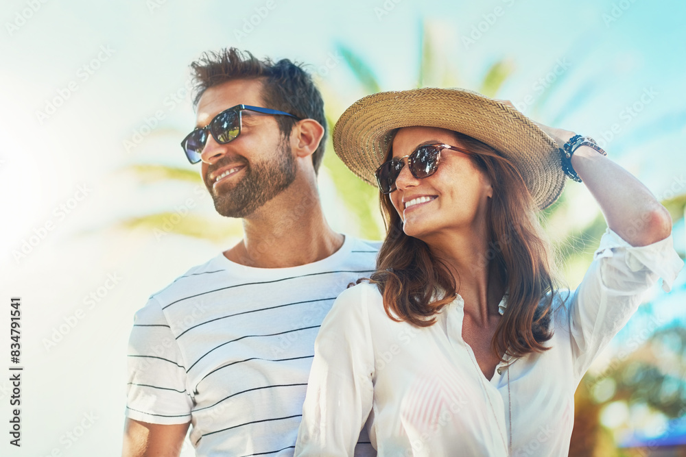 Poster Couple, people and smile on holiday in outdoor with sunglasses for summer holiday and fun in Spain. Relationship, love and happy with support or on vacation, trip and travel together as soulmate