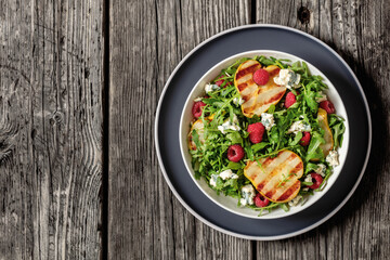 grilled pear salad with cheese, arugula, berries