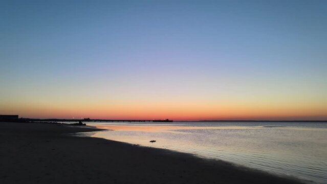 Drone shot of a sunrise in Cape Cod beach.