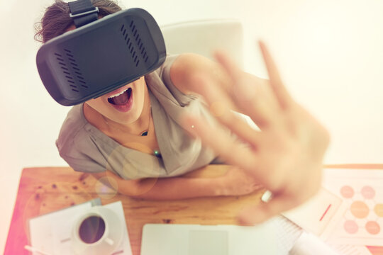 Woman, interface and touch in office with virtual reality tech for ui, wow and futuristic innovation. Person, surprise and AR glasses for programming, shock and IT for user experience in workplace