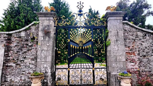 Ornate guilded gold gates in Powerscourt Gardens in Wicklow Ireland Epic locations