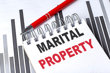 MARITAL PROPERTY text on notebook on chart with pen