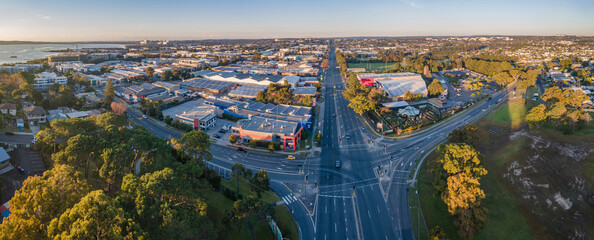 Panoramic aerial drone view above Taren Point in Sutherland Shire, Sydney NSW, Australia looking over Taren Point Road toward Caringbah on a sunny morning in May 2024