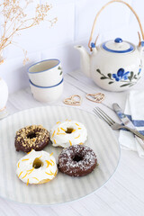 White kitchen table prepared for a tea snack.