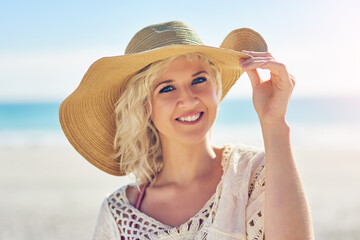 Beach, summer and portrait of woman with smile for travel, adventure and tropical vacation at sea. Weekend, nature and female person with hat by ocean for outdoor holiday, happiness or trip in Cancun