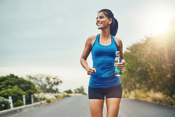 Thinking, runner or happy woman drinking water on break to hydrate or relax for healthy energy in...