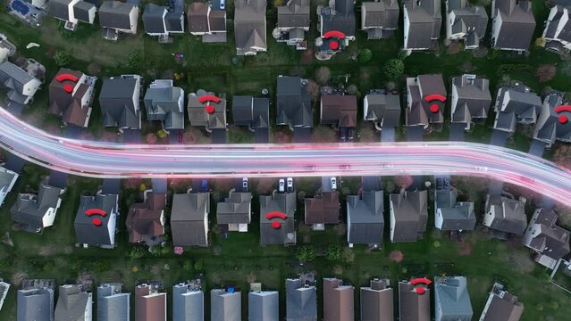 American neighborhood with houses connected to vibrant, flowing fiber optic network system with 5G WiFi access. Top down aerial shot with animation, motion graphics.