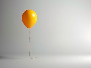 Single yellow balloon tethered