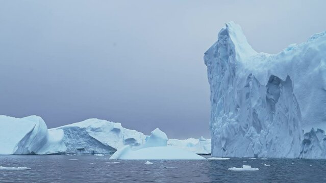 Amazing Shapes of Big Blue Icebergs, Antarctica Ocean Seascape Scenery of Massive Bizzare Beautiful Icebergs Floating in Sea Water in Cold Winter Scene, Amazing Nature in Dramatic Scenery