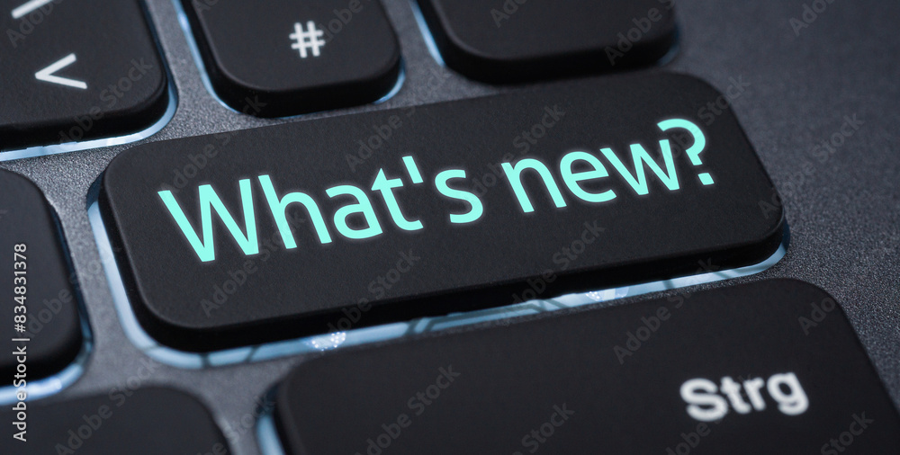 Wall mural illuminated keyboard with a labeled key - whats new