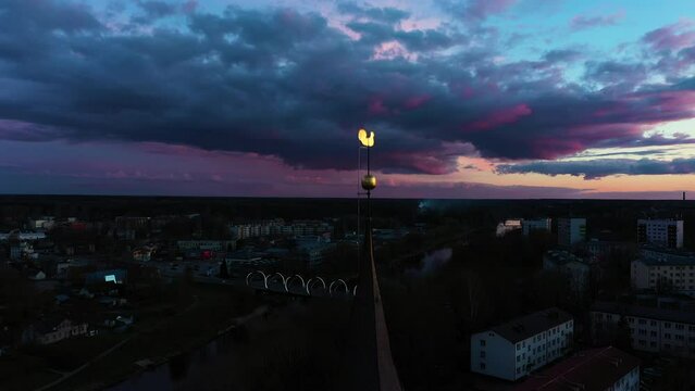 Dramatic Evening Sky Over Valmiera, Latvia with Silhouetted St. Simon's Church Tower