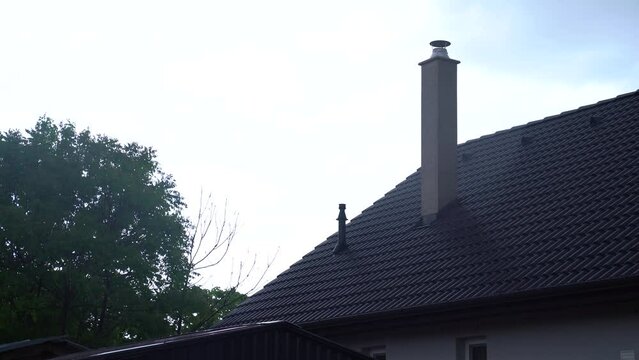 View of a house covered with a modern roof impervious to heavy rain