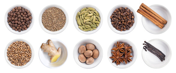 Spices and scents of Christmas season and of winter holidays, in white bowls. Upper row allspice,...