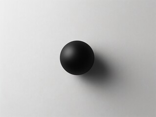 A spherical object on a plain surface casting a shadow