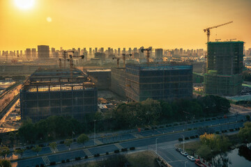 City construction site at sunset