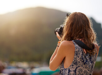 Camera, photographer and woman by mountain on vacation, travel or summer holiday in Switzerland....