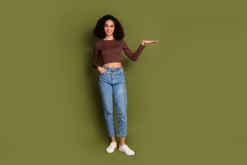 Full length photo of lovely young lady show measure dressed stylish brown garment isolated on khaki...