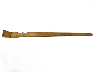 Wooden backscratcher facing up isolated on white background