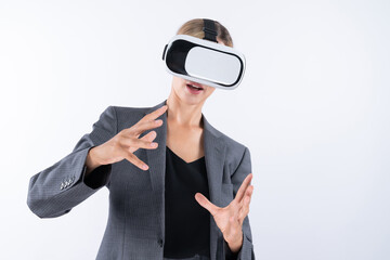 Business woman holding something while wearing VR goggle and standing at white background. Project...