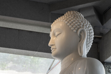 White Buddha statue at Gangaramaya Temple, Sri Lanka