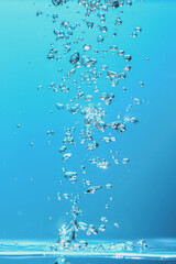 Underwater Bubbles Rising in Clear Blue Water with Sunlight Reflections - Perfect for Backgrounds,...