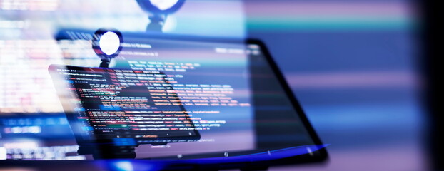 Work from home. Programmer coding code on notebook screen at home.