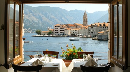 Obraz premium an elegant dining setup arranged in an outdoor restaurant, offering panoramic views of the bay and historic buildings lining the harbor, creating a picturesque dining experience.