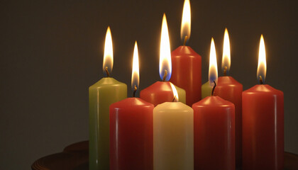 Fototapeta premium Illuminating the Christmas Eve service with glowing candles in the church