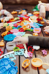 kids playing with colorful toys in the summer hands fun cheerful family kindergaten