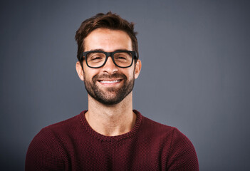 Studio, glasses and man with smile, face and wellness with eye care, product and lens for vision. Grey background, portrait and happiness for person, prescription and eyewear with fashion in USA