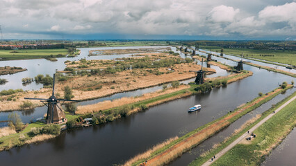 Fototapeta premium Aerial View of Windmills on Water Canal in Village Kinderdijk, The Netherlands