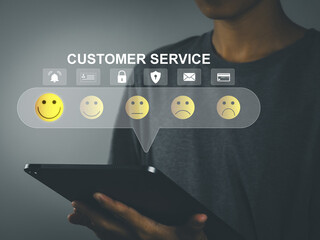 Customer service evaluation concept, customer is rating selected satisfied smiley face emoji on...