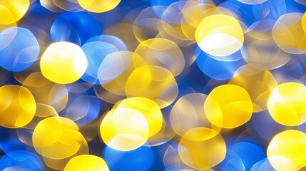 Abstract blurred bokeh lights in blue and yellow create a mesmerizing backdrop, perfect for festive and celebratory themes.