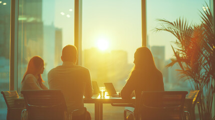 Silhouetted people in a meeting at sunset in an office, against an urban skyline background, concept of business teamwork. Generative AI