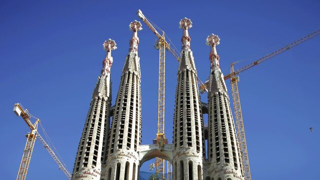 sagrada familia cathedral in barcelona with construction cranes