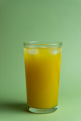 Ripe Mango Juice with Green Background