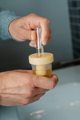 man collecting a urine sample