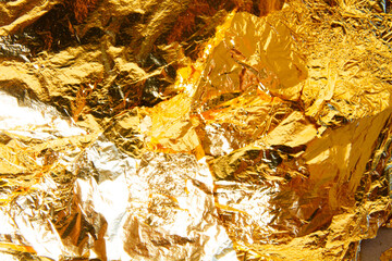 The background of crushed gold shines golden
