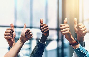 Hands, success and thumbs up with business people closeup in glass office for promotion, solidarity...