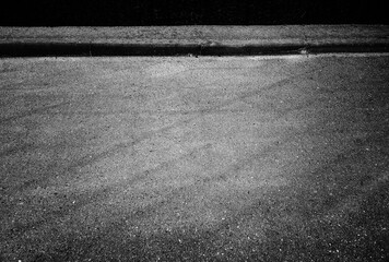 Fototapeta premium Glass reflections on asphalt road background