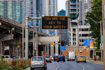 Safety message displayed on urban road sign